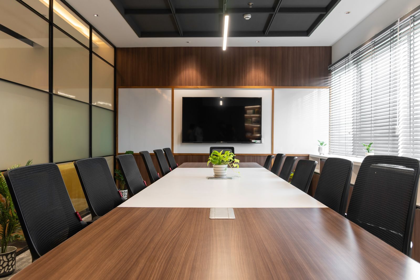Elegant modern boardroom with wooden conference table, suited for legal and accountancy practices